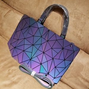 Geometric handbag with shoulder strap.